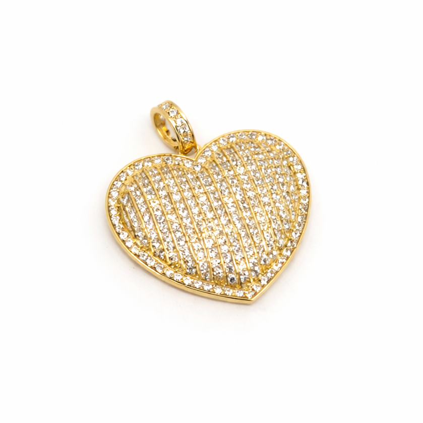 Gold heart-shaped pendant with embedded stones on a white background