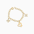 Gold bracelet with heart and butterfly charms on a white background
