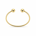 Gold bracelet with two spherical ends on a white background