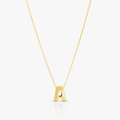 Gold necklace with a letter 'A' pendant on a light gray background