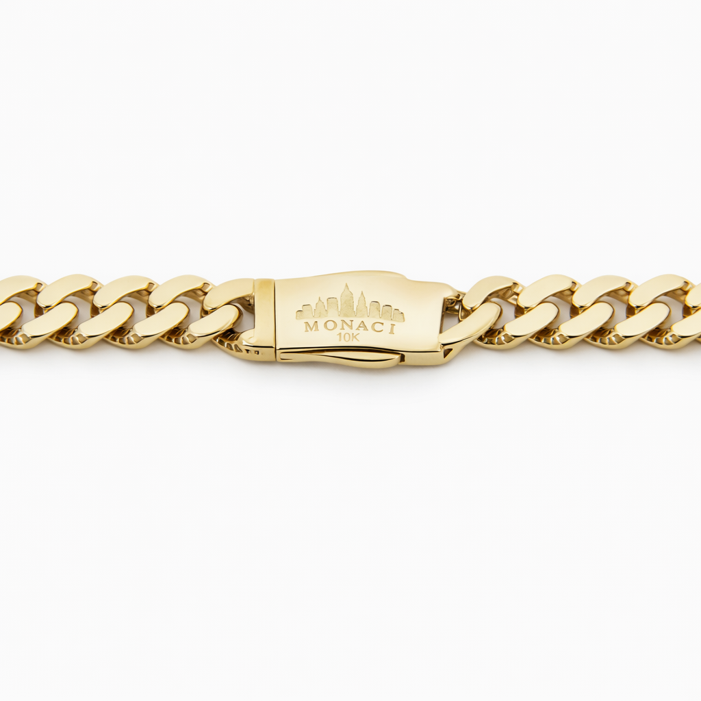 Gold chain bracelet with a visible brand logo on a white background