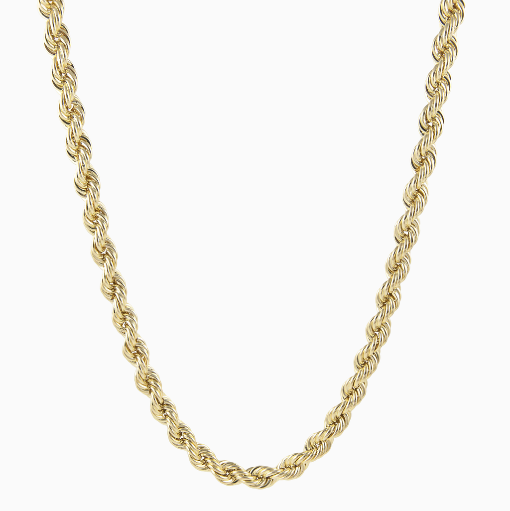 Gold rope chain necklace on a white background